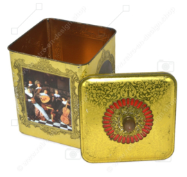 Square tin drum with a gold-coloured knob with an image of paintings by Dutch masters