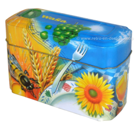 Orange and blue tin box for Wasa Crackers with images of a rooster, bee, sunflower, grain and fruit