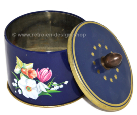Vintage tin canister with knob and floral decor of daffodils, lily and butterfly by Côte d'Or