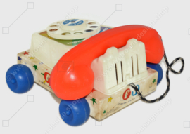 De originele vintage Fisher-Price "Chatter" Speelgoedtelefoon uit 1961