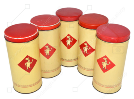 La boîte à biscuits en étain crème / jaune clair est fabriquée par Bolletje avec un couvercle rouge