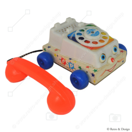 De originele vintage Fisher-Price "Chatter" Speelgoedtelefoon uit 1961