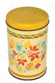 Lata de galletas vintage con estampado de flores estilizadas en rojo, amarillo y azul