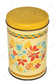 Vintage biscuit tin with stylized flower pattern in red, yellow and blue