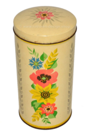 Cylindrical yellow vintage biscuit tin by Verkade, with colored flowers.