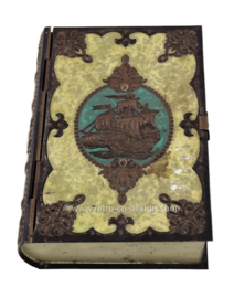 Vintage tin in the shape of a book with sailing ship on the cover