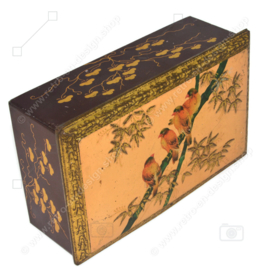 Rectangular tin drum on which birds on a branch and leaf motifs in relief, with lock