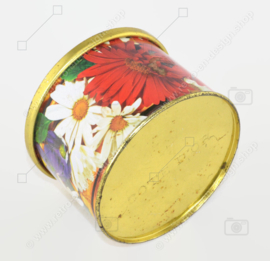 Multicoloured tin can with button and floral motifs by Côte d'Or