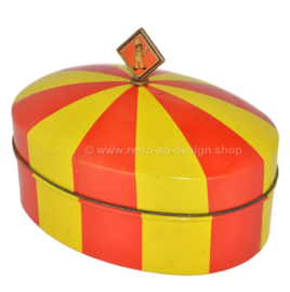 Oval shaped vintage biscuit tin in red and yellow, in the shape of a circus tent made by Bolletje