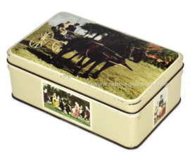 Vintage grey tin with color pictures of Frisian subjects