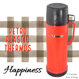 Découvrez le charme intemporel de cette thermos rétro rouge avec sa tasse de boisson noire !