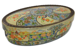 Ovale dekorative Blechdose mit asiatischem Blumenmuster und breiter Bordüre