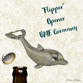 Vintage bottle opener in the shape of a dolphin