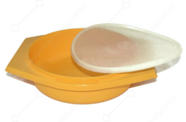 Vintage Tupperware slicing bowl in yellow with white grater and transparent lid