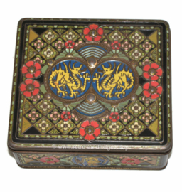 Vintage square tea tin with oriental motifs, dragons, wajang and flowers