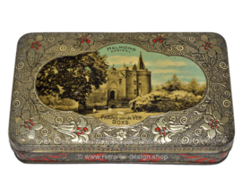 Old vintage tin drum with an image of the HELMOND Castle