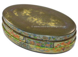 Oval decorative tin with Asian floral design and wide border