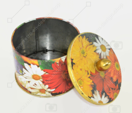 Multicoloured tin can with button and floral motifs by Côte d'Or