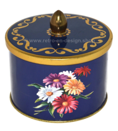 Vintage blue tin with knob and floral decoration of gerberas by Côte d'Or