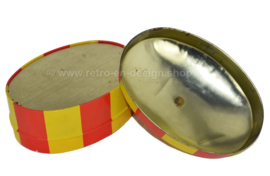 Oval shaped vintage biscuit tin in red and yellow, in the shape of a circus tent made by Bolletje