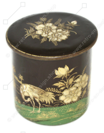 Round vintage tin canister made by De Gruyter decorated with cranes