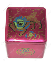 Vintage tin cube for tea by Van Nelle with an image of an Oriental lion or Chinese dragon