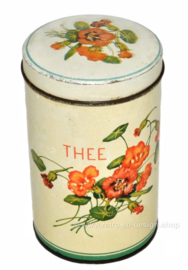 Vintage blikken cylindrische theebus met bloemendecoratie