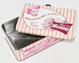 Pink retro tin for biscuits by Hema with pictures of the shop's interior