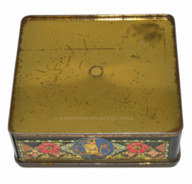 Vintage square tea tin with oriental motifs, dragons, wajang and flowers