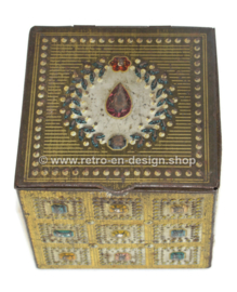 Vintage tin jewellery box in cube shape with details of gemstones