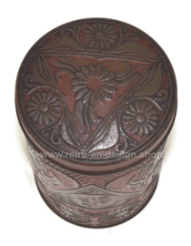 Red tin canister with embossed floral motif for cocoa powder by EJO