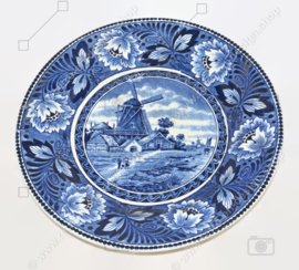 Earthenware wall plate by Société Céramique Maastricht depicting windmills in a Dutch polder landscape