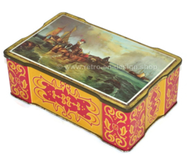 Scalloped vintage tin with an image of fishing boats