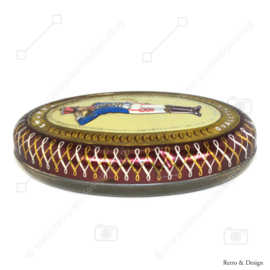 Oval tin box with an image of a soldier on the lid made by KWATTA chocolate