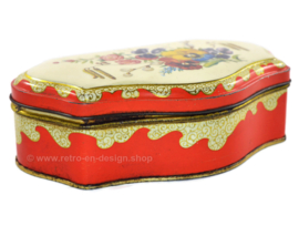 Red vintage tea tin by the Gruyter with spring or summer bouquet