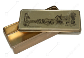 Gold-coloured tea tin or spoon box by Douwe Egberts with carriage and tea house