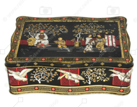 Vintage theeblik in rood, goud en zwart met oosterse voorstellingen