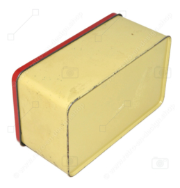 Vintage cream-coloured tin with red hinged lid