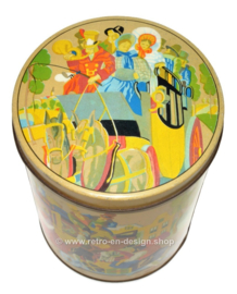 Large nostalgic tin drum with romantic images around a stagecoach