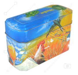 Caja de lata naranja con azul para Crackers de Wasa con imagen de gallo, abeja, girasol, cereal y fruta