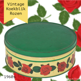Round vintage biscuit tin with rose decoration and green lid