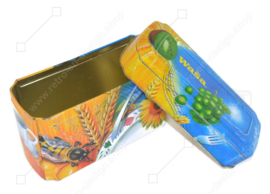 Orange with blue tin box for Crackers from Wasa with an image of rooster, bee, sunflower, grain and fruit