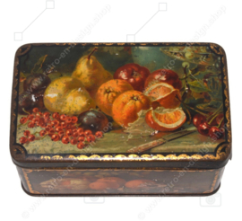 Vintage candy or cookie tin with still lifes of fruit pieces on all sides