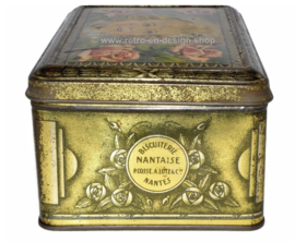 Vintage tin La Biscuiterie Nantaise with a young girl and roses on the lid