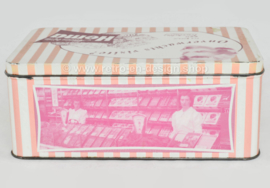 Pink retro tin for biscuits by Hema with pictures of the shop's interior