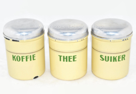 Set of three cream-coloured brocante enamelled storage containers for Coffee, Sugar and Tea with reseda green letters