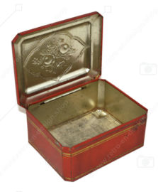 Rectangular red tin with gold-coloured details and floral decoration
