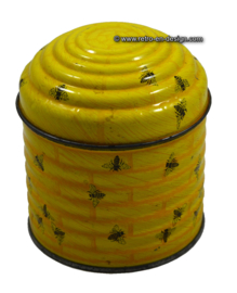Rond geel blik of trommel in vorm van bijenkorf