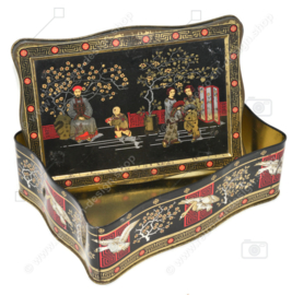 Vintage tea tin in black, gold and red with oriental images