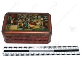 Vintage biscuit tin with an image of an interior inn for de Gruyter